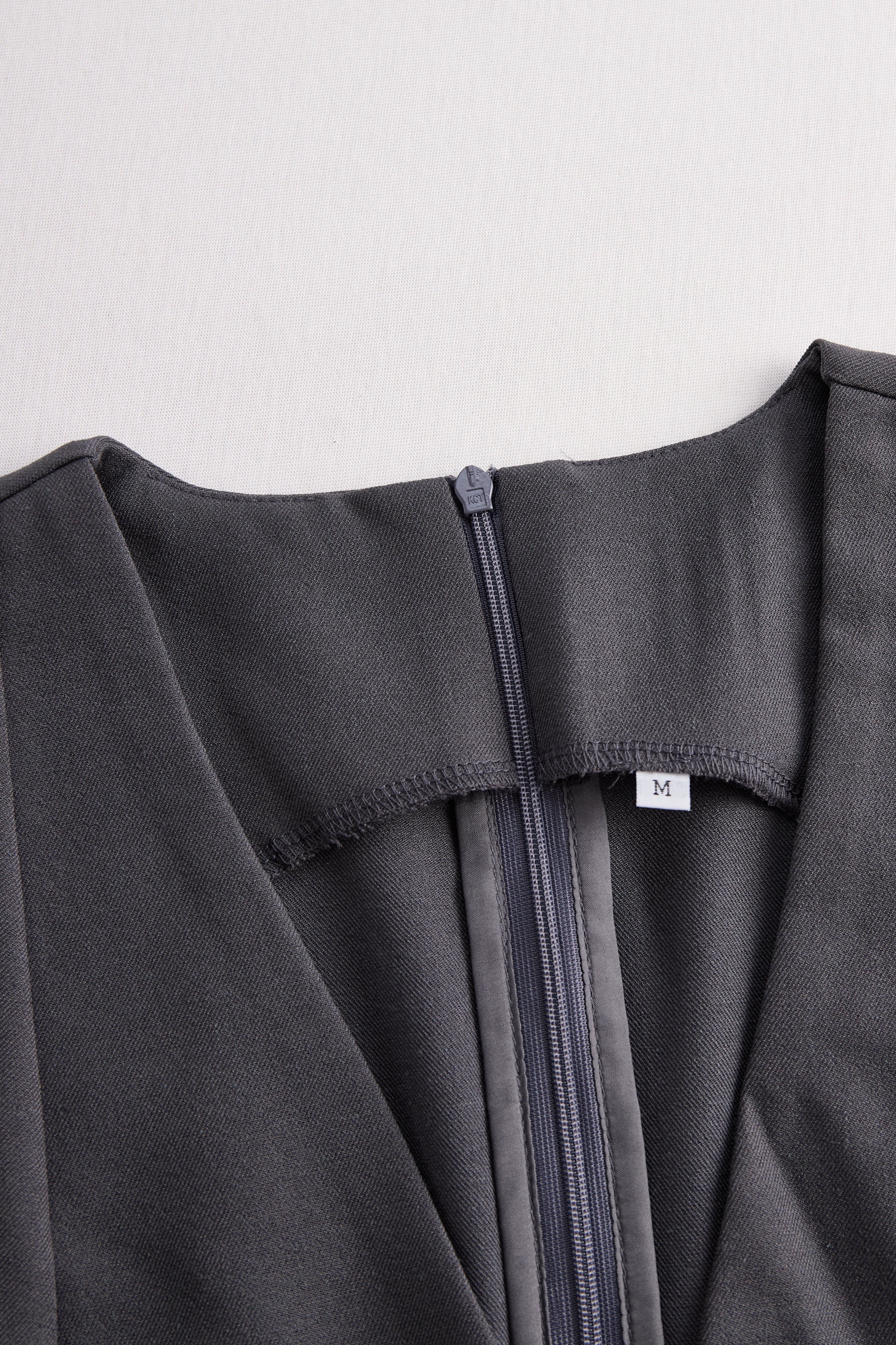 Sophisticated Sleeveless Peplum Jumpsuit In Charcoal Gray | Elegant Women's Dress