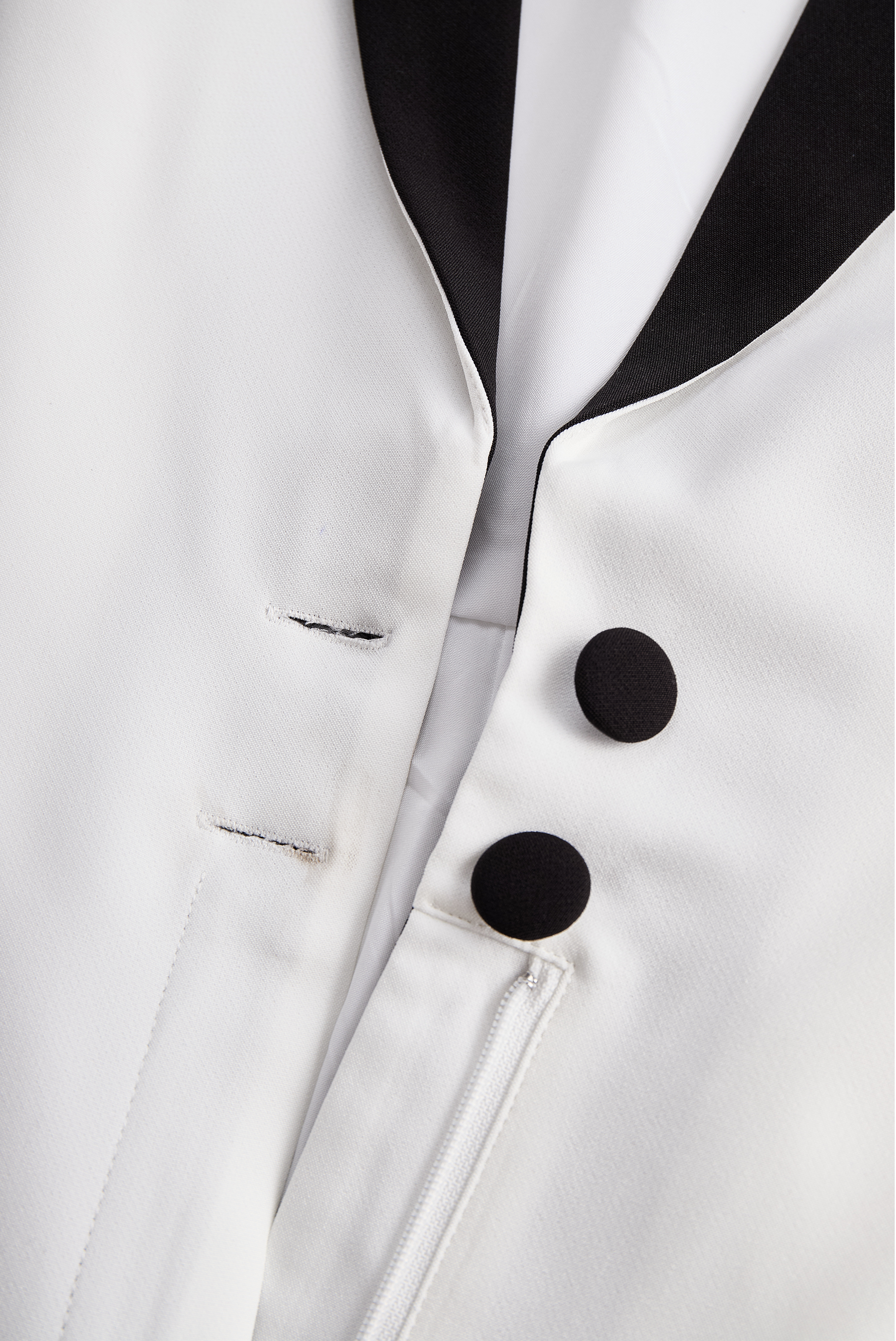 Sleek White Jumpsuit With Dual Button Detail And Black Lapel | Elegant Women's Dress